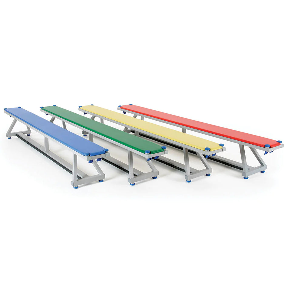 Four Niels Larsen Litabench Upholstered Top 2.4m benches in blue, green, yellow, and red with silver aluminium frames are arranged side by side on a white background. Each bench has blue protective corner caps for safety.