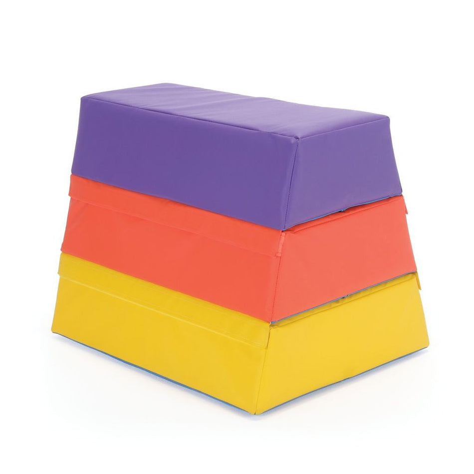 The Niels Larsen Activsoft 3 Section Vault Box by Niels Larsen features three stackable foam sections in purple, red, and yellow for children's gymnastics or play, with hook and loop fastenings, displayed against a white background.