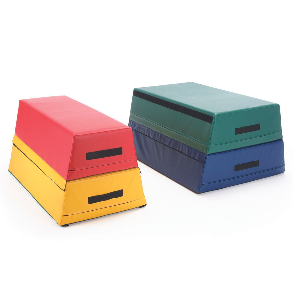 Two Niels Larsen Activsoft 4 Section Vault Boxes are stacked. One is yellow, red, and light red; the other is dark green, green, and blue with black handles. Both are modular and ideal for gymnastics or physical activities.