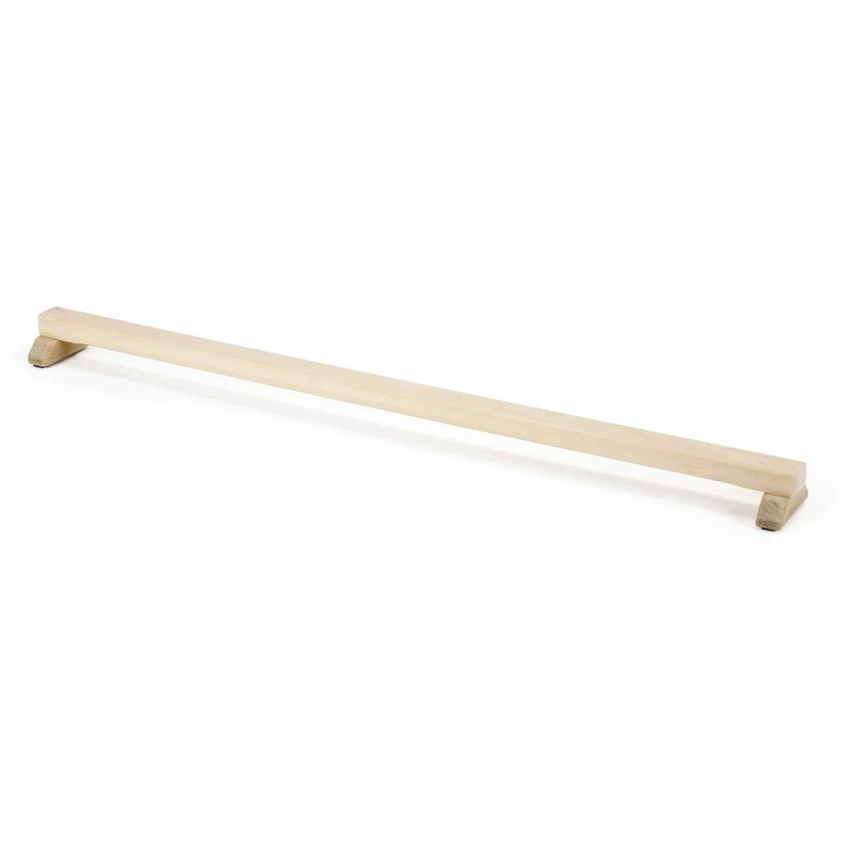 The Niels Larsen Junior Floor Beam by Niels Larsen is a long, light natural timber balance bar with small raised supports at each end, shown on a white background.