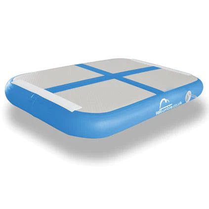 The Niels Larsen Airtumble AirBoard is a rectangular inflatable mat with a blue border, grey surface, and two intersecting blue lines. Made from durable double wall fabric by Niels Larsen, it’s ideal for jumpers of all skill levels.