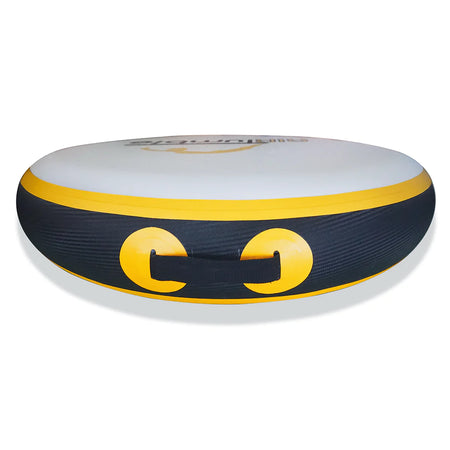 The Niels Larsen Airtumble Airspot is a round inflatable snow tube with a white top, black sides, and a yellow stripe. It has two yellow circles, a front black handle, and inflates fast with a foot pump for instant winter fun.