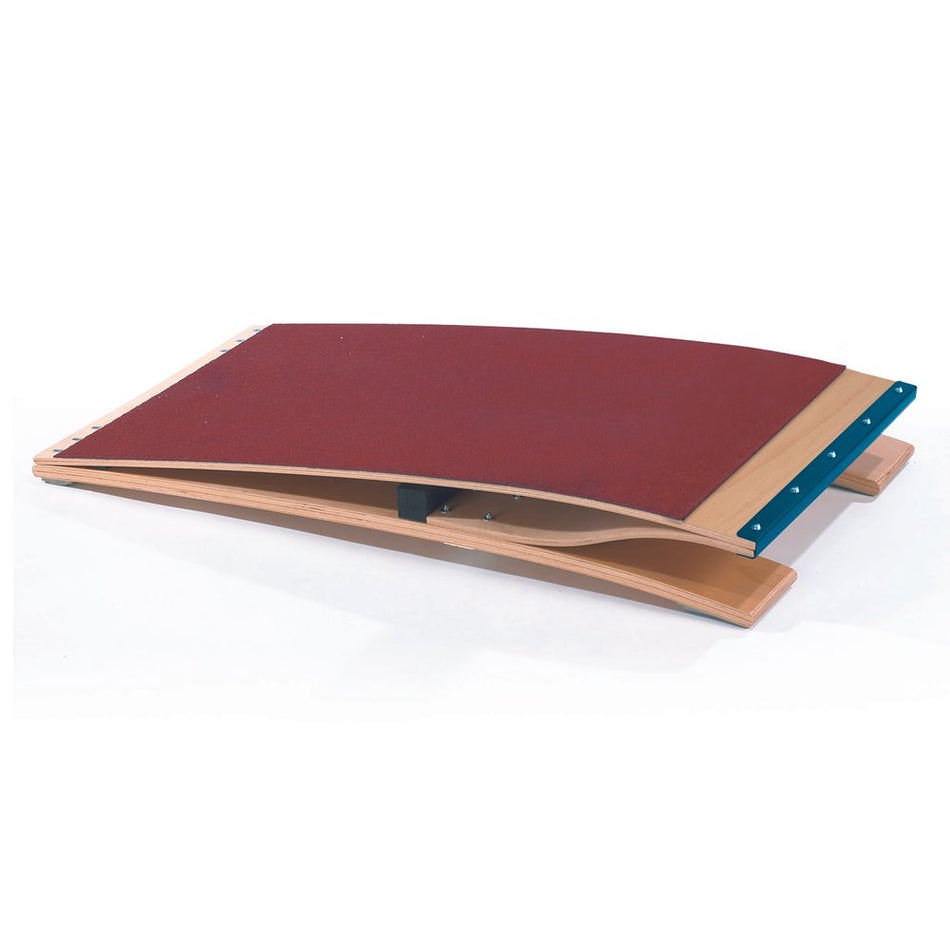 The Niels Larsen Standard Springboard is a durable Reuther-style wooden vaulting board with moulded plywood construction, a red carpet top, and blue metal trim, designed by Niels Larsen for gymnastics vaulting exercises.