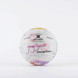 The Gilbert Ambassador Signature Netball by Gilbert, size 5, features vibrant designs and visible signatures—including George Fisher—on a white background, making it an ideal collector’s ball for netball fans.