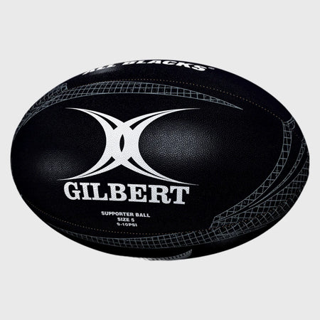The Gilbert All Blacks Supporter Rugby Ball Size 5 by Gilbert features black and white detailing, the GILBERT logo, and displays "SUPPORTER BALL SIZE 5" and "ALL BLACKS," making it ideal for New Zealand rugby fans.