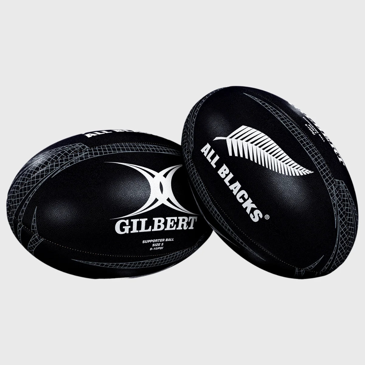 A Gilbert All Blacks Supporter Rugby Ball Size 5, featuring the GILBERT logo and silver fern, sits on a plain gray background—ideal for any New Zealand rugby fan's collection.