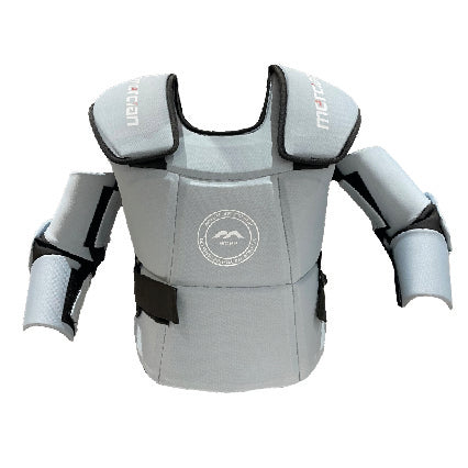 The Mercian Genesis 3 Body Armour Grey by Mercian is a light gray, padded training suit with arm and shoulder protection, black straps, and a chest logo. Lightweight and inspired by hockey goalie gear, it’s ideal for safe martial arts contact practice.