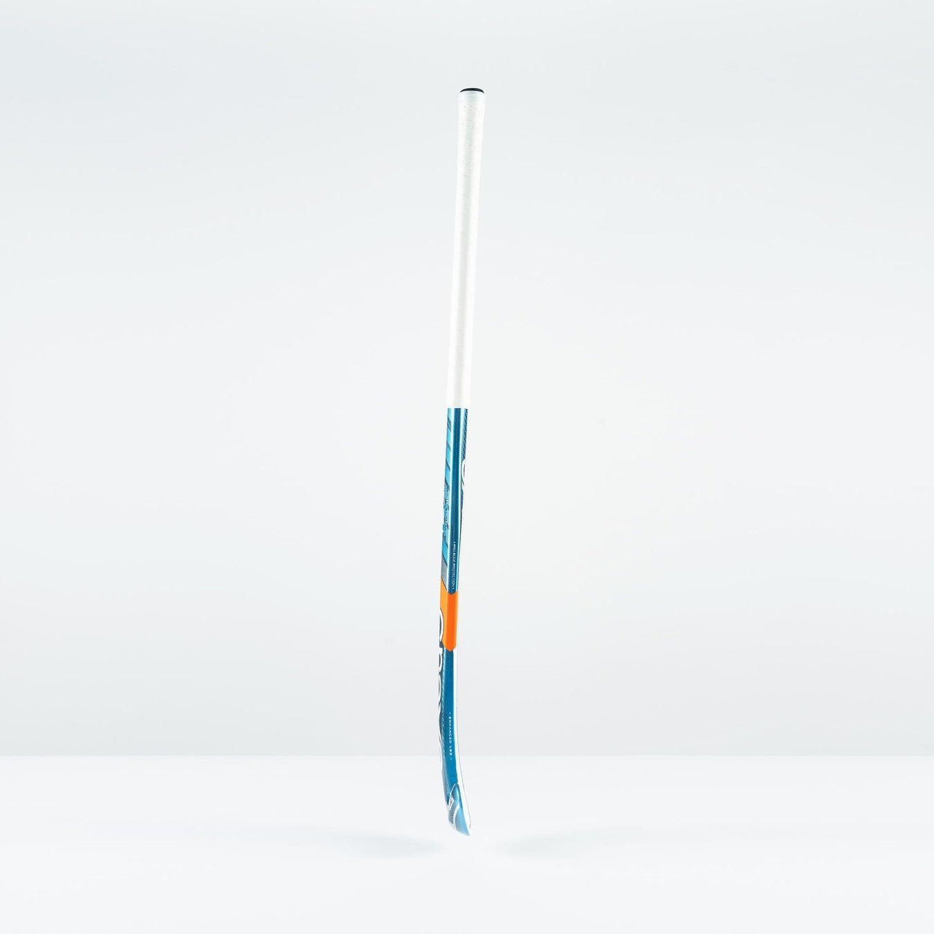 The Grays JB 7+ Junior Hockey Stick 2026, in blue and white, featuring advanced Graphene for improved drag-flicking control, stands upright on a plain white surface against a light gray background.