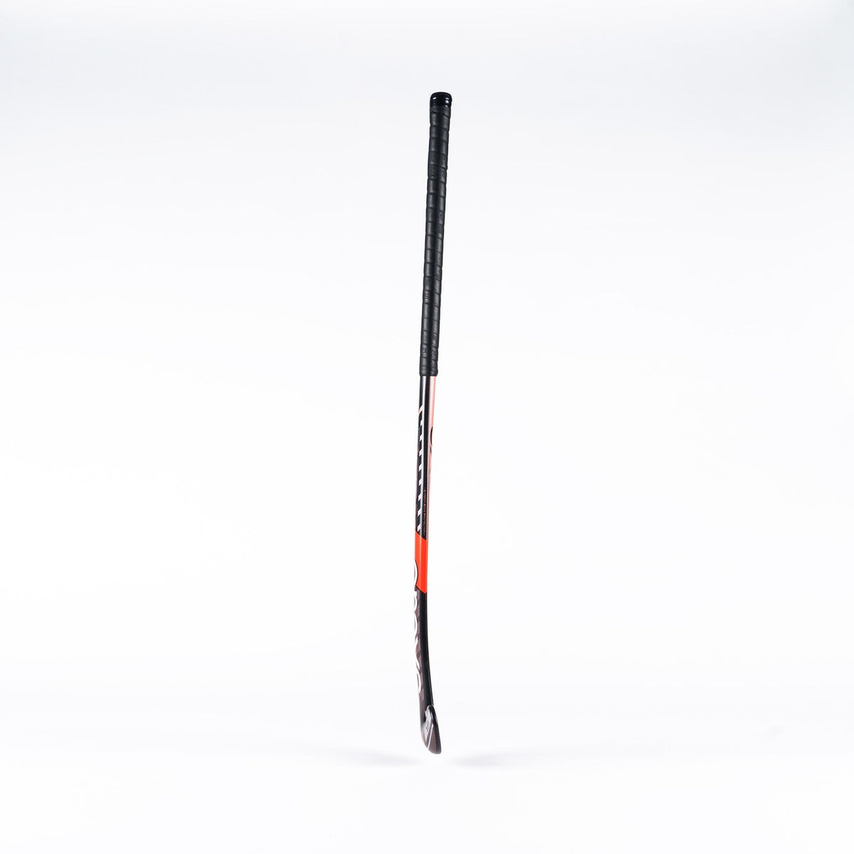 A Grays DB6 Junior Hockey Stick by Grays, featuring a black grip, red and black shaft, and curved blade, stands upright against a plain white background.