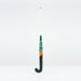 The Grays PB 7+ Junior Hockey Stick 2026 is a black graphene stick with a white handle and green and orange accents. "Grays" is printed vertically on the shaft, offering intermediate power and supreme control against a white background.