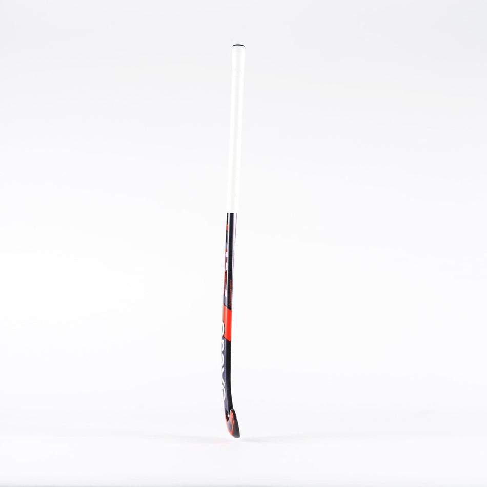 The Grays Jumbow 7 Senior Hockey Stick, featuring a white handle and a black, red, and white curved lower section ideal for drag-flicking, stands upright against a plain white background.