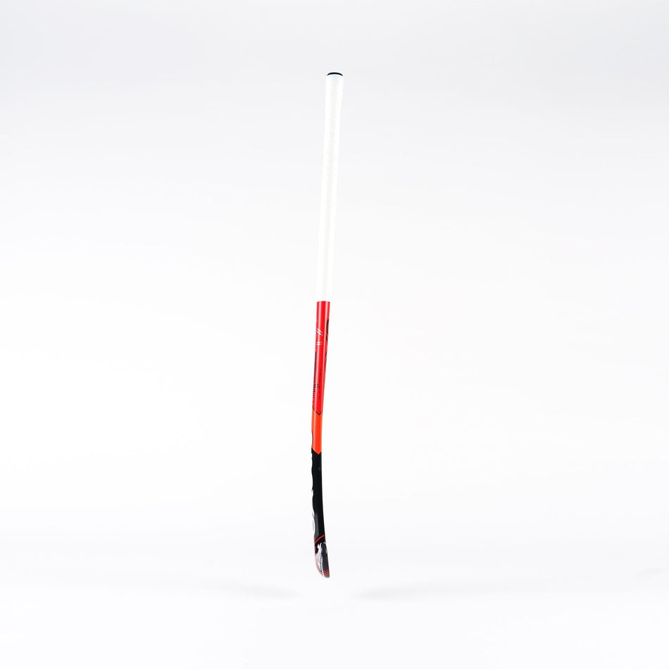 The Grays MB4 Senior Hockey Stick by Grays, featuring a black, red, and white midbow design for enhanced torsional stability, is standing upright against a plain white background.