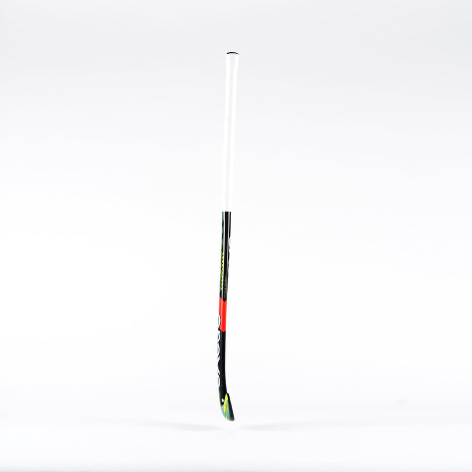 A single Grays PB7 Senior Hockey Stick by Grays, in black and white with red and green accents, stands upright against a plain white background.