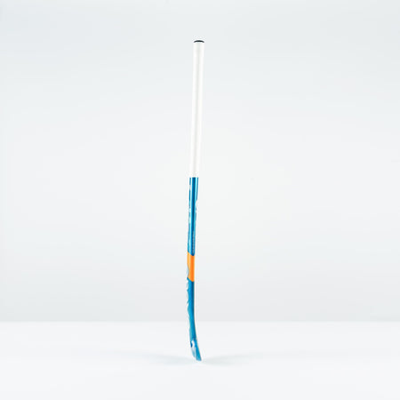 The Grays JB 6 Senior Hockey Stick 2026 stands upright on a white surface with a light gray background—perfect for players honing their drag-flicking skills.