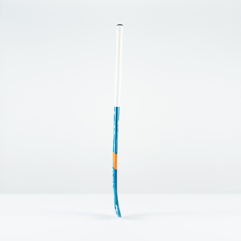 The Grays JB 6 Senior Hockey Stick 2026 stands upright on a white surface with a light gray background—perfect for players honing their drag-flicking skills.