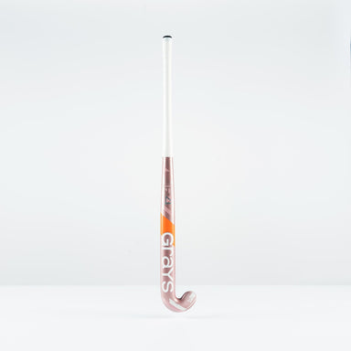 The Grays JB 4 Senior Hockey Stick 2026, in pink and white with "Grays" branding and a Jumbow blade profile, stands upright against a plain white background.