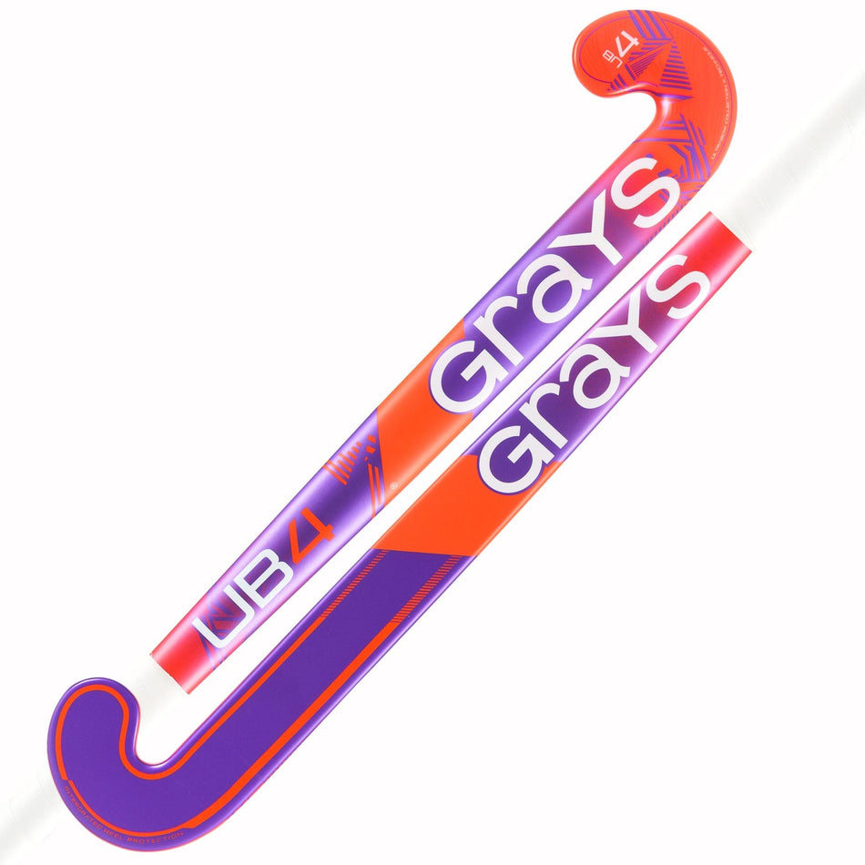 Two Grays UB4 Junior Hockey Sticks with Ultrabow blade design overlap on a white background. Each stick shows the Grays brand in bold, purple/orange colors, and "UB4" near the curved ends for intermediate control.