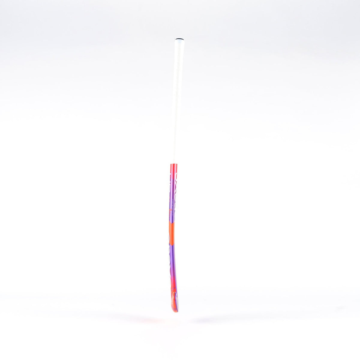 The Grays UB4 Junior Hockey Stick by Grays features an Ultrabow blade for intermediate control, with a white handle fading into red and purple, shown against a plain white background.