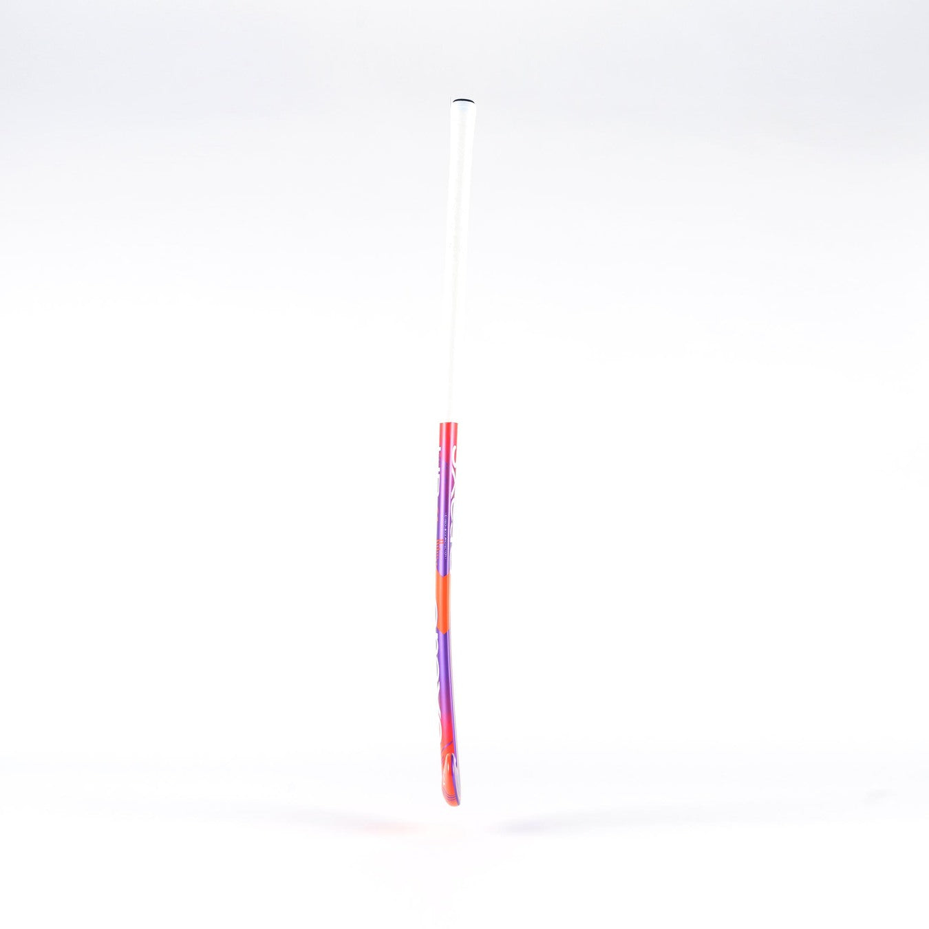 The Grays UB4 Junior Hockey Stick by Grays features an Ultrabow blade for intermediate control, with a white handle fading into red and purple, shown against a plain white background.