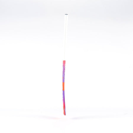 The Grays UB4 Junior Hockey Stick by Grays features an Ultrabow blade for intermediate control, with a white handle fading into red and purple, shown against a plain white background.