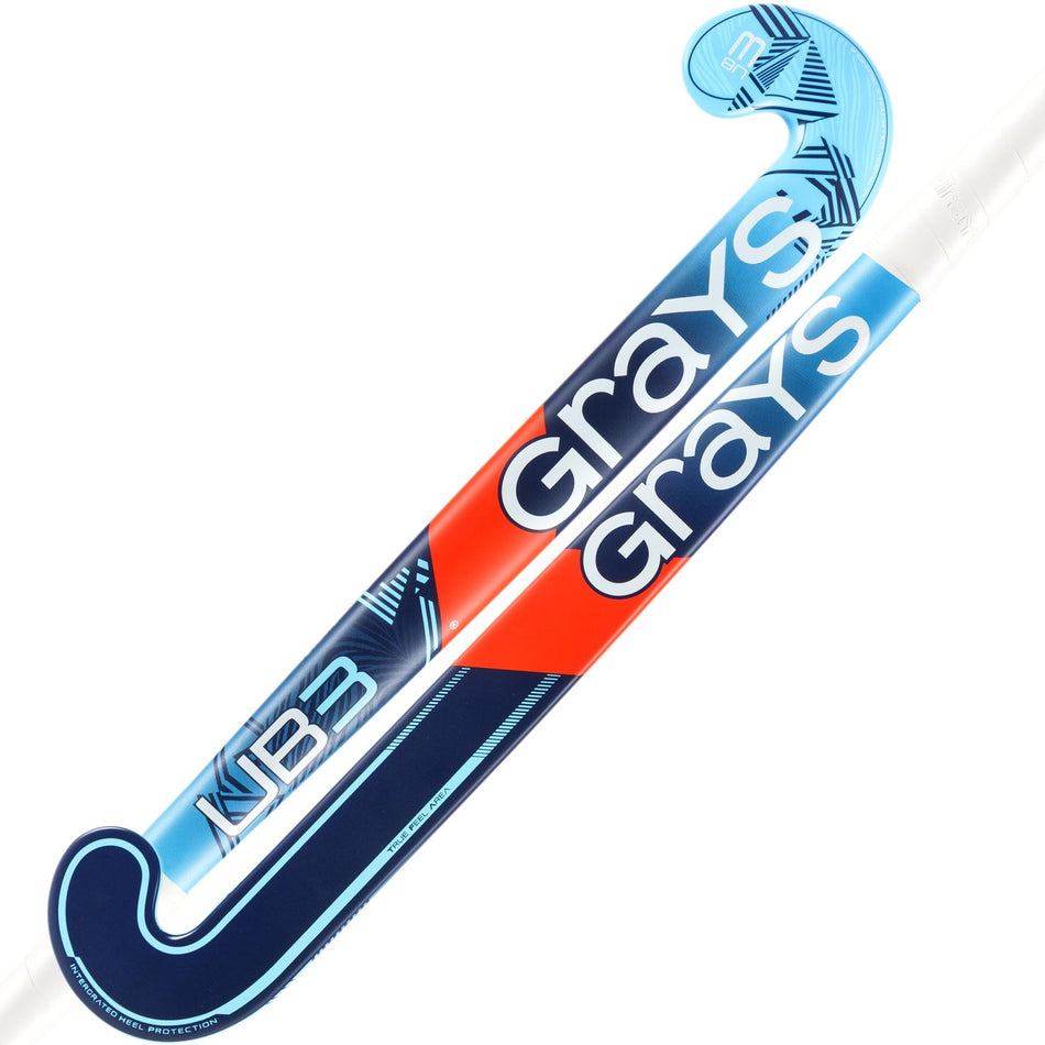 Two blue Grays UB3 Junior Hockey Sticks are crossed, each featuring the “Grays” brand name in bold white letters and showcasing an Ultrabow blade designed for superior ball control.