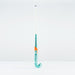 The Grays DB 5 Junior Hockey Stick 2026, in teal and white with orange accents and a Dynabow blade, stands upright on a white surface against a plain white background.