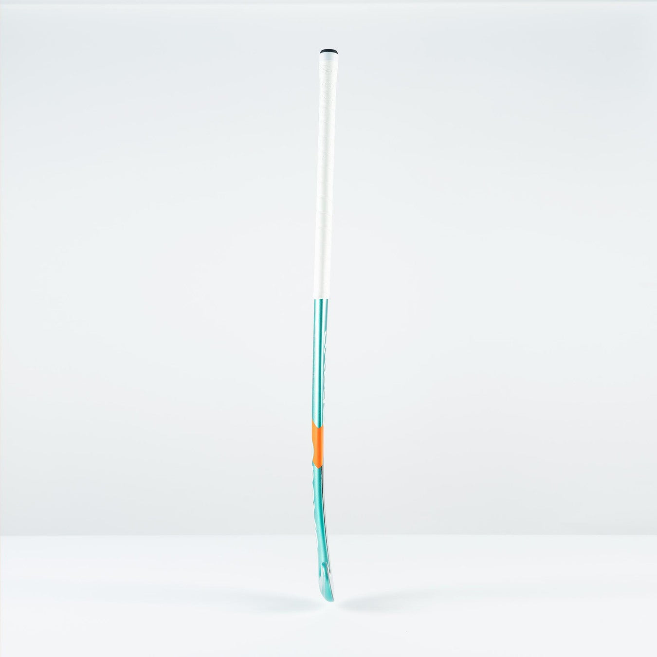 The Grays DB 5 Junior Hockey Stick 2026 by Grays stands upright with a white handle, turquoise lower section, and orange accent—perfect for enhanced 3D skill execution against a plain white background.