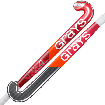 Two red Grays DB 4 Junior Hockey Sticks 2026 with white handles, bold white branding, and black and silver accents near the curved Dynabow blade for enhanced 3D skills on the field.