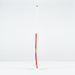 The Grays DB 4 Junior Hockey Stick 2026, in red and white with a Dynabow blade profile, stands upright on a plain white surface against a light gray background, designed by Grays for enhanced 3D skill execution.