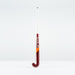 The Grays GT 5 Senior Hockey Stick 2026 stands upright against a white background, showcasing a maroon curved head and shaft with Grays branding in white, an orange diagonal stripe, and a high bow apex for intermediate power and control.