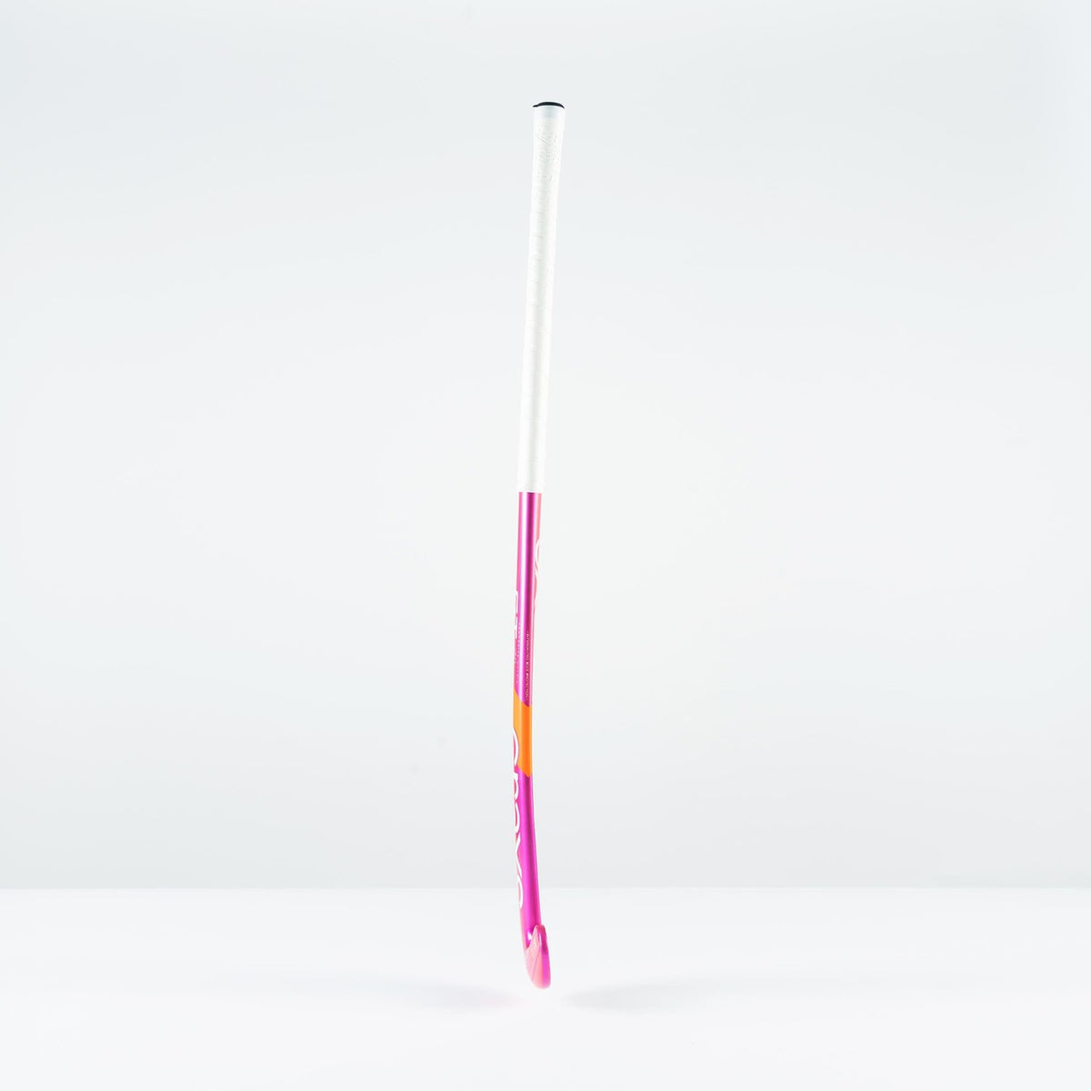 The Grays GT 4 Senior Hockey Stick 2026 by Grays, with a pink and white design, stands upright on a plain white surface—ideal for all-round performance and intermediate control.