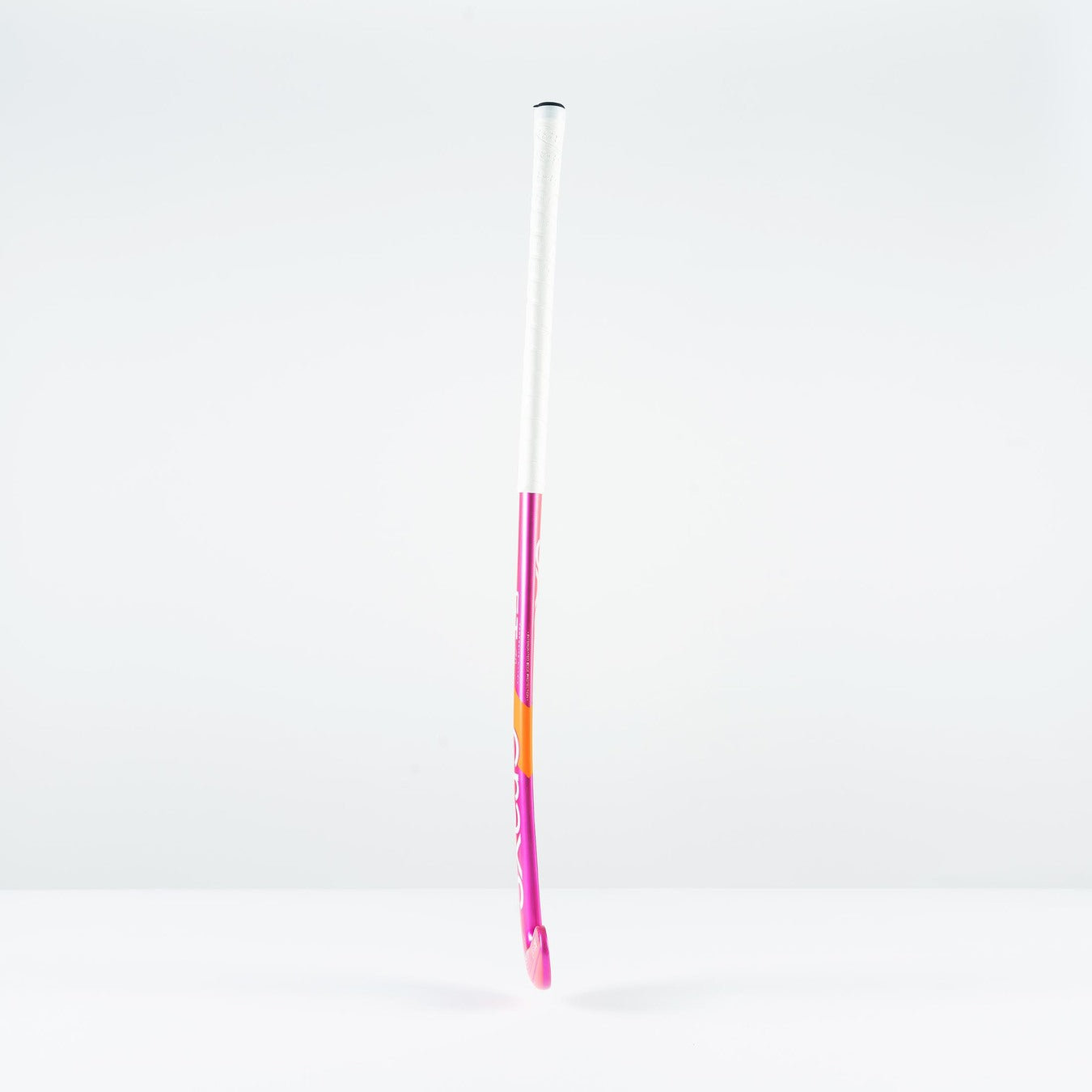 The Grays GT 4 Senior Hockey Stick 2026 by Grays, with a pink and white design, stands upright on a plain white surface—ideal for all-round performance and intermediate control.