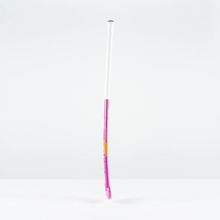 The Grays GT 4 Senior Hockey Stick 2026 by Grays, with a pink and white design, stands upright on a plain white surface—ideal for all-round performance and intermediate control.