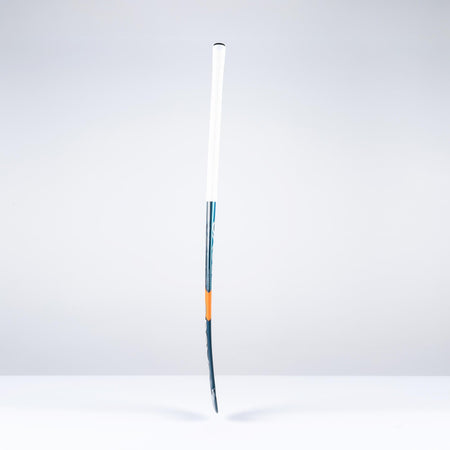 The Grays DB4Xi Dynabow Indoor Senior Hockey Stick 2026 stands upright against a white background, featuring a white grip, blue shaft, and orange accent—its sleek form highlighting the quality craftsmanship from Grays.