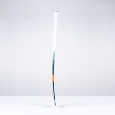 The Grays DB4Xi Dynabow Indoor Senior Hockey Stick 2026 stands upright against a white background, featuring a white grip, blue shaft, and orange accent—its sleek form highlighting the quality craftsmanship from Grays.