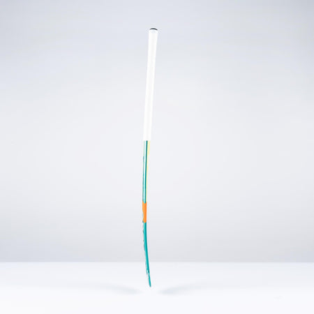 The Grays DB1Xi Dynabow Indoor Senior Hockey Stick 2026 stands upright against a plain white background, its sleek form and design by Grays reminiscent of an artist’s brush dipped in blue and orange.