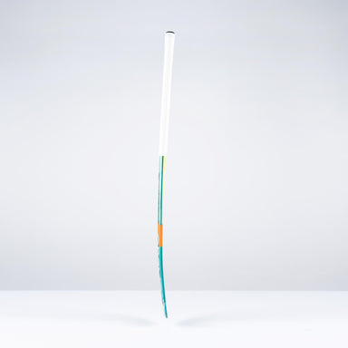 The Grays DB1Xi Dynabow Indoor Senior Hockey Stick 2026 stands upright against a plain white background, its sleek form and design by Grays reminiscent of an artist’s brush dipped in blue and orange.