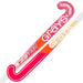 The Grays GT0Xi Ultrabow Indoor Junior Hockey Stick 2026 features bold pink, red, and gold colors, is perfect for developing core skills in indoor hockey, and displays the Grays logo prominently along the GT blade profile shaft.