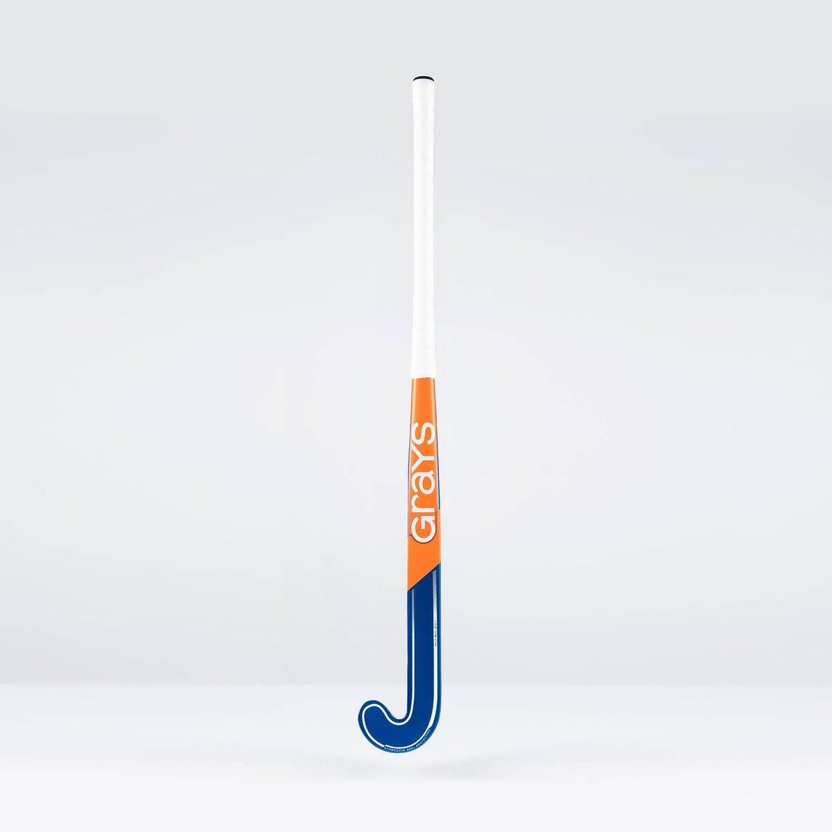 The Grays JB6GXi Jumbow Indoor Senior Hockey Stick, in blue, orange, and white, stands upright against a plain light gray background—expertly crafted by Grays for maximum control and precision in indoor play.