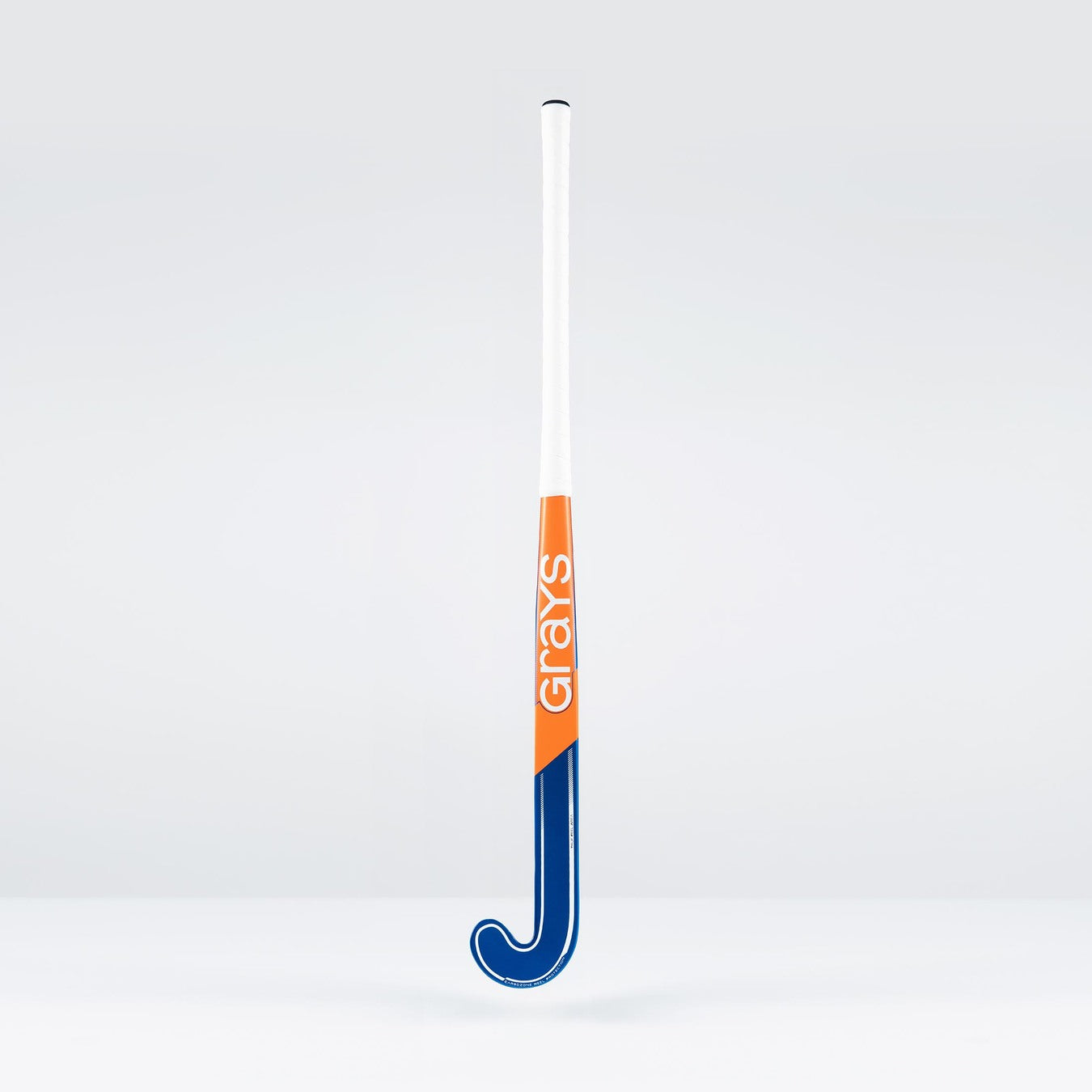The Grays JB6GXi Jumbow Indoor Senior Hockey Stick, in blue, orange, and white, stands upright against a plain light gray background—expertly crafted by Grays for maximum control and precision in indoor play.