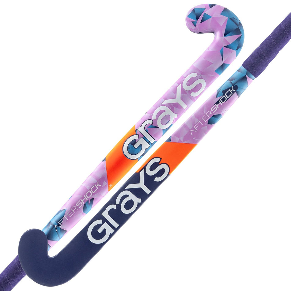 The Grays Aftershock Wooden Hockey Stick by Grays features a classic bow shape, contoured handle, and vibrant purple/blue design—perfect for young players looking for style and performance.