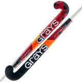 The Grays Aftershock Wooden Hockey Stick, designed for young players, comes in red and black with classic bow shape and white handle, featuring stylish geometric and orange accents.