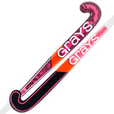 Two Grays Impulse GT Wooden Hockey Sticks are shown in hot red and black, both with the Grays logo and curved blades, displayed side by side. Ideal for young players moving up from a basic wooden stick.