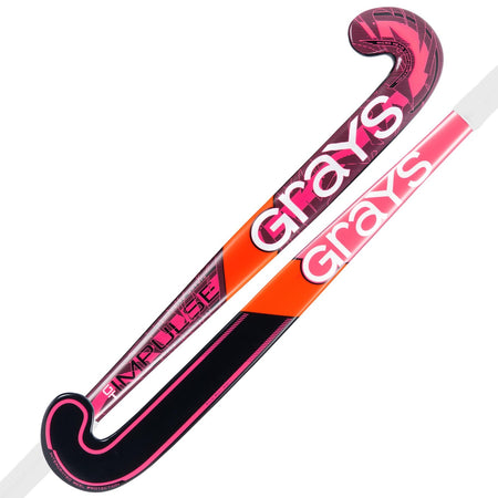 Two Grays Impulse GT Wooden Hockey Sticks are shown in hot red and black, both with the Grays logo and curved blades, displayed side by side. Ideal for young players moving up from a basic wooden stick.