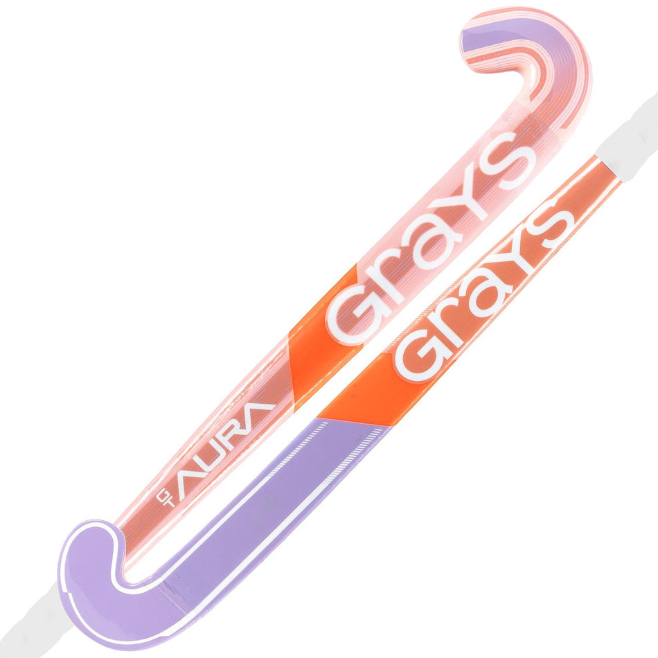 Two Grays Aura GT Wooden Hockey Sticks in pink and lilac, ideal for young players, display the Grays brand name in bold white along the shaft and "AURA" printed near the handle.