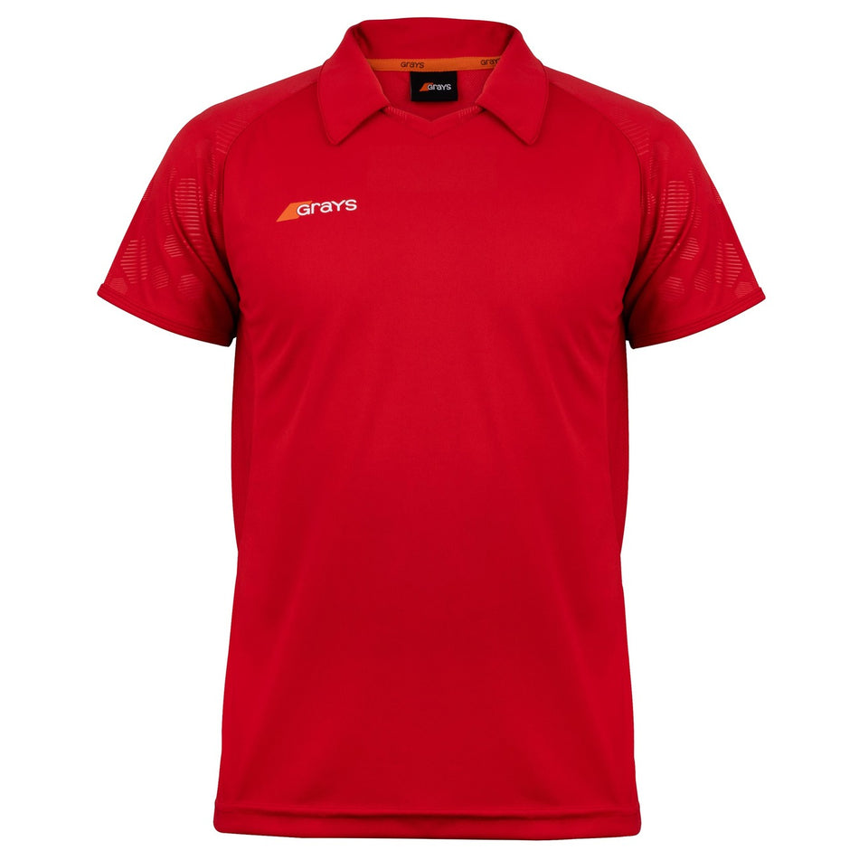The Grays Axis 750 Hockey Shirt is a red V-neck sports shirt with short raglan sleeves, a collar, and the Grays logo in orange and white on the left chest. It features subtle patterned sleeves and mesh panels for breathability. Displayed on white background.