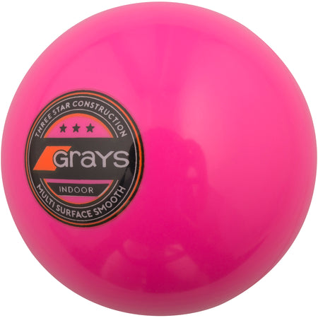 The Grays Indoor Hockey Ball is a bright pink indoor field hockey ball featuring the black and orange Grays logo, marked "3-Star construction, Multi Surface Smooth" on the side.