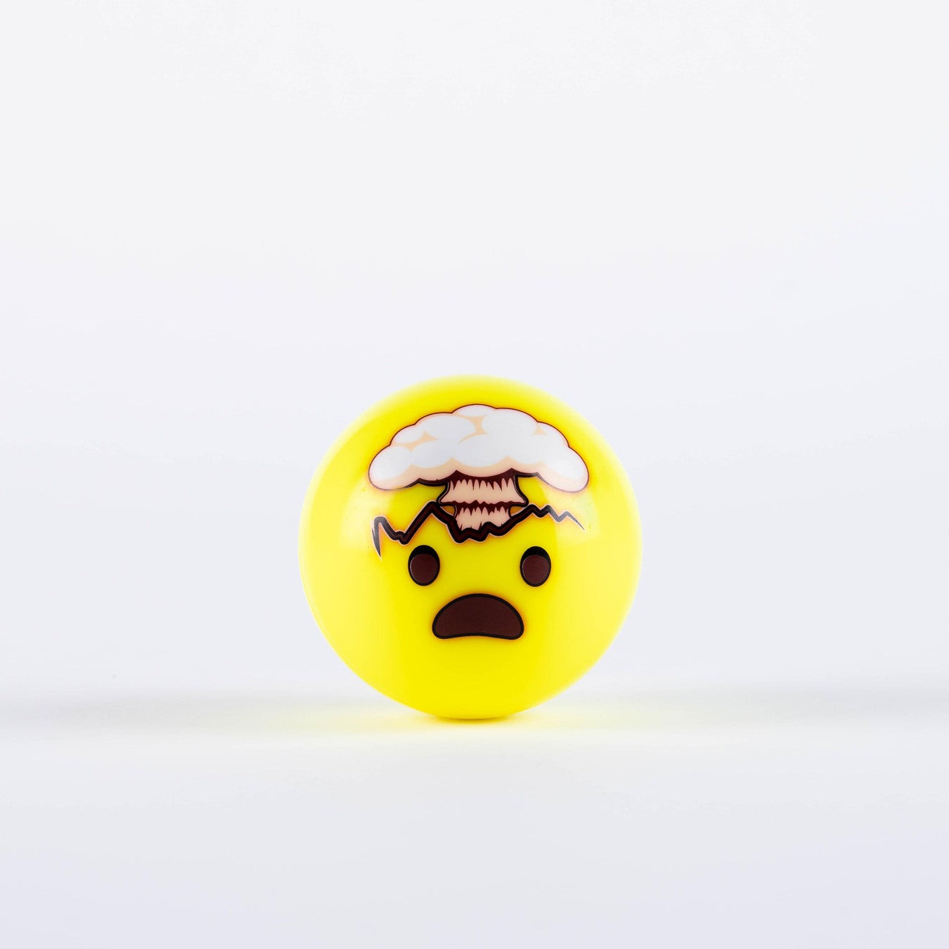 The Grays Emoji Hockey Ball by Grays features a yellow, round design with a surprised emoji face and cartoon mushroom cloud—making it a fun 2025 gift for hockey players that captures the ultimate mind-blown reaction.