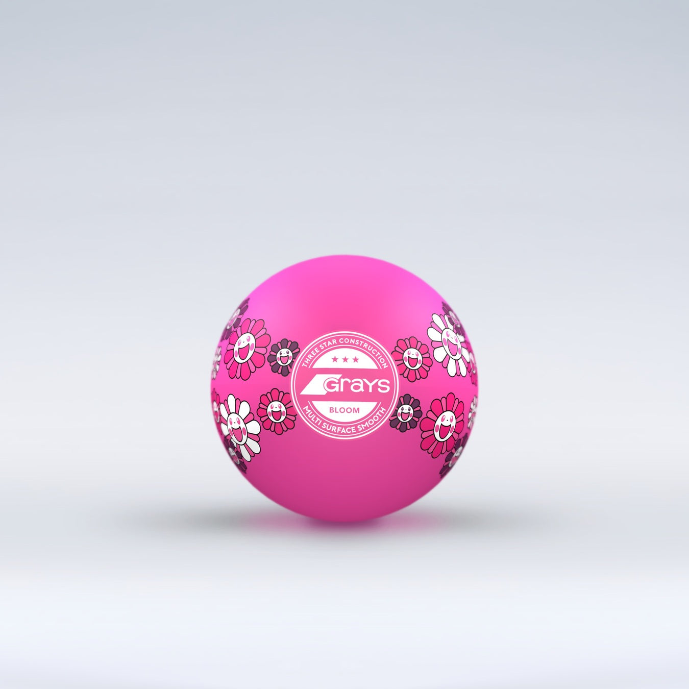 The Grays Novelty Hockey Ball 2026 features pink coloring with floral patterns, a central white Grays logo, and 3 star construction—perfect for hockey players. The ball sits against a light gray gradient background.