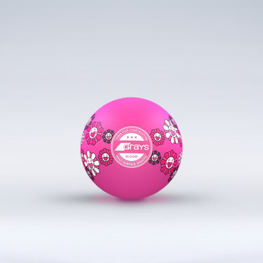 The Grays Novelty Hockey Ball 2026 features pink coloring with floral patterns, a central white Grays logo, and 3 star construction—perfect for hockey players. The ball sits against a light gray gradient background.